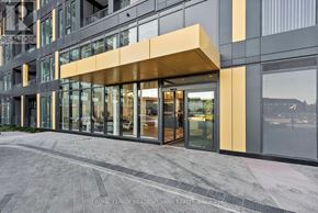Burlington (Alton) condo for rent - A modern building with a glass entrance and a yellow awning.