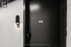 Burlington (Alton) condo for rent - A black door with a handle and a lock with the number 1510 on it.