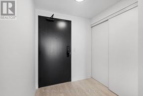 Burlington (Alton) condo for rent - A black door with a handle and a small black knob on a white wall.