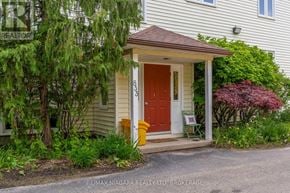 Pelham (Fenwick) multi-family for rent - A house with a red door and a sign that says RE/MAX Niagara Realty Ltd, Brokerage.