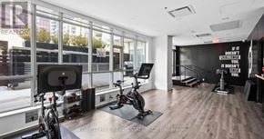 Toronto (Waterfront Communities) condo for rent - A gym room with a sign that says "If it doesn't challenge you, it doesn't improve you."
