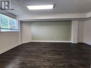 Vaughan (Patterson) apartment for rent - A room with wooden flooring and a window letting in natural light.