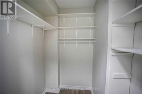 Mississauga (Applewood) condo for rent - A white pantry with shelves and a brokerage logo.