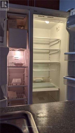 Mississauga (Applewood) condo for rent - A photo of an empty refrigerator with the door open.