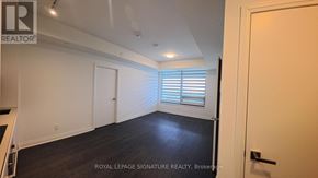 Mississauga (City Centre) condo for rent - A room with a white door and a window with blinds.