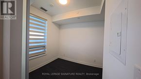 Mississauga (City Centre) condo for rent - A white wall with a light switch and a window with blinds.