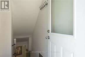 Hamilton (Rosedale) apartment for rent - A white door with a glass window and a handle.