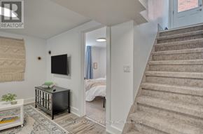 Hamilton (Rosedale) apartment for rent - A living room with a staircase leading to the bedroom.