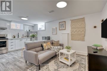Hamilton (Rosedale) apartment for rent - A living room with a grey couch and a white coffee table.
