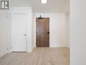 Mississauga (Clarkson) condo for rent - A room with a white door and a wooden door.