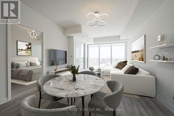 Mississauga (Clarkson) condo for rent - A modern living room with a round marble table and grey chairs.