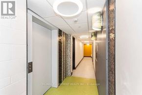 Hamilton (Beasley) condo for rent - A hallway with a white wall and a door on the left.