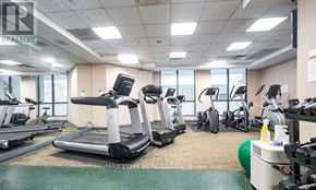 Toronto (Lansing-Westgate) condo for rent - A gym with treadmills, elliptical machines, and other exercise equipment.
