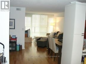 Toronto (Bay Street Corridor) condo for rent - A living room with a couch, chairs, and a dining table.