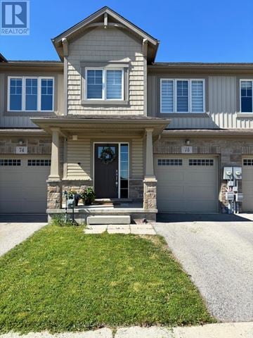 Thorold (Hurricane/Merrittville) townhouse for rent - A house with a grey facade and a black door is shown.