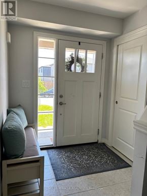 Thorold (Hurricane/Merrittville) townhouse for rent - A white door with a glass window is in a hallway.