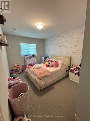 Thorold (Hurricane/Merrittville) townhouse for rent - A small child's bedroom with a bed, pink bedding, and toys scattered around.