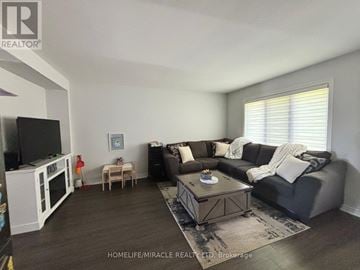 Thorold (Hurricane/Merrittville) townhouse for rent - A living room with a grey couch and a coffee table.