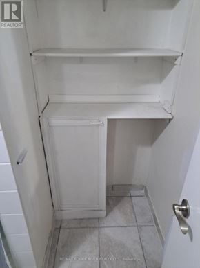 Toronto (Rouge) apartment for rent - A white refrigerator with a door open in a small room.