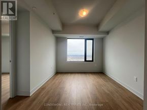 Vaughan (Concord) condo for rent - Empty room with a window and wooden flooring.