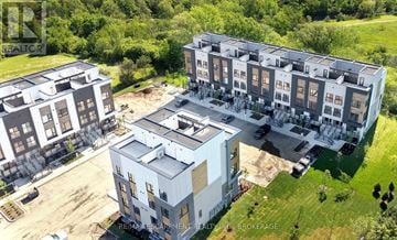 St. Catharines (E. Chester) townhouse for rent - A bird's eye view of a residential complex with two buildings and a parking lot.