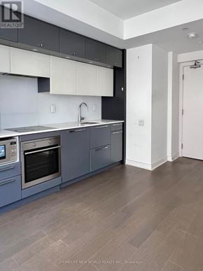 Toronto (Bay Street Corridor) condo for rent - A modern kitchen with a stainless steel oven and a sink.