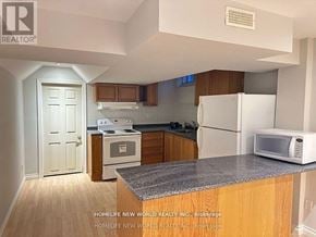 Richmond Hill (Rouge Woods) apartment for rent - A kitchen with a white refrigerator, white oven, and white microwave.