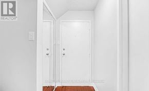 Toronto (West Hill) townhouse for rent - A white door with a handle and a lock.
