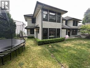 West Vancouver apartment for rent - A modern house with a trampoline in the yard.
