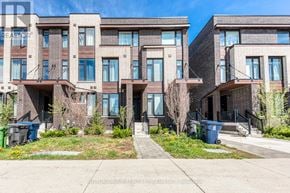 Toronto (Rustic) townhouse for rent - Apartment building with a clear blue sky above.