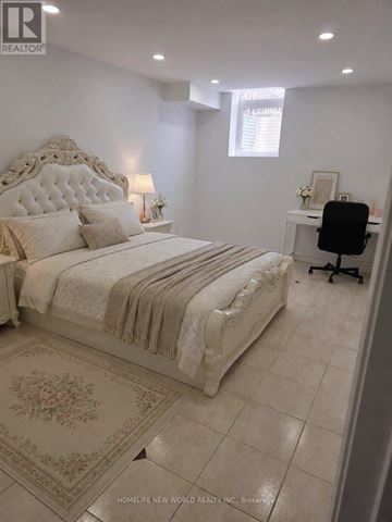 Markham (Middlefield) apartment for rent - A bedroom with a large bed and a desk with a chair.