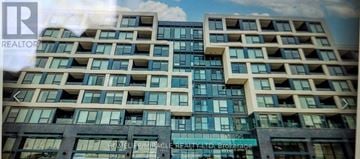 Oakville (Wm Westmount) condo for rent - A large building with many windows and balconies is shown.
