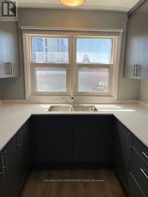Halton Hills (Georgetown) multi-family for rent - A kitchen with a sink and a window.