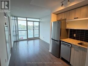 Toronto (Little Portugal) condo for rent - A kitchen with a refrigerator, dishwasher, and a sink.
