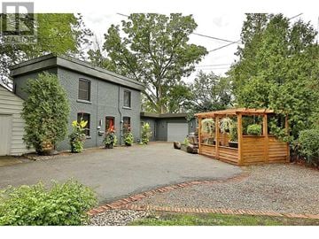 Burlington (Bayview) apartment for rent - A house with a grey exterior and a wooden deck.