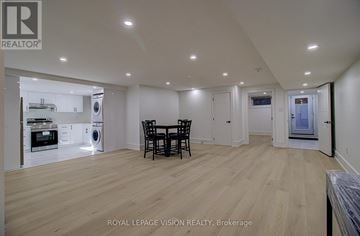 Toronto (Cliffcrest) apartment for rent - A spacious kitchen with a dining table and chairs.