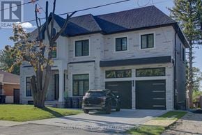 Toronto (Cliffcrest) apartment for rent - A modern two-story house with a black car parked in front.