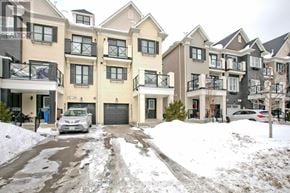 Whitchurch-Stouffville townhouse for rent - A snowy street with apartment buildings and a car parked in front.