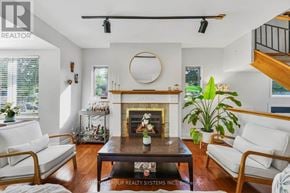 Toronto (Cliffcrest) apartment for rent - A living room with a fireplace and a couch.