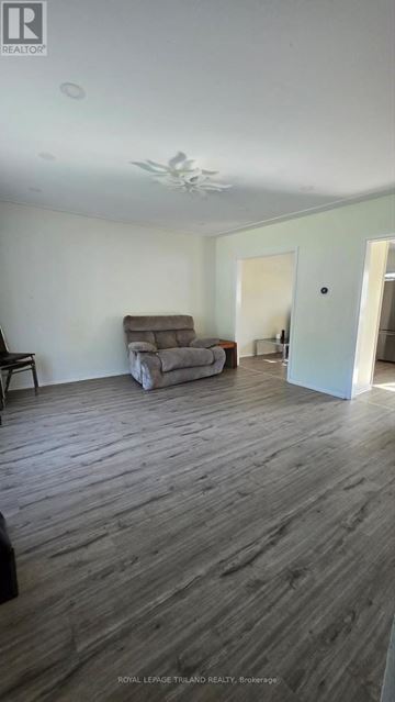 London East (East D) apartment for rent - A living room with a couch and a chair.