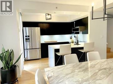 Vancouver townhouse for rent - A modern kitchen with a dining table and chairs.