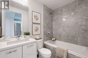 Toronto (Moss Park) condo for rent - A bathroom with a toilet, sink, and bathtub.