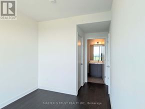 Toronto (Newtonbrook West) condo for rent - A white room with a doorway leading to another room.