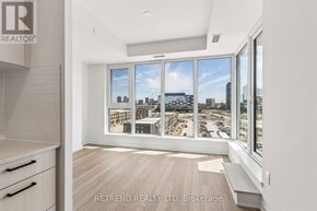 Toronto (Banbury-Don Mills) condo for rent - A room with a view of the cityscape through large windows.