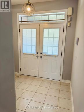 Vaughan (Vellore Village) townhouse for rent - A white double door with a glass window and a handle.