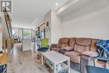 Oshawa (Samac) townhouse for rent - A living room with a brown sofa and a white coffee table.
