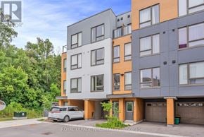 Oshawa (Samac) townhouse for rent - A modern multi-story residential building with a car parked in front.