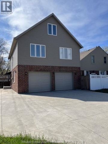 Windsor apartment for rent - A two-story house with a garage is for sale.