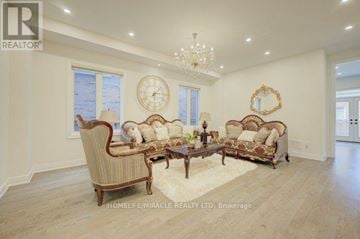 Milton (Fo Ford) apartment for rent - A living room with a sofa set and a chandelier.