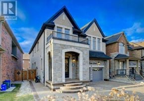 Milton (Fo Ford) apartment for rent - A large house with a stone facade and a blue roof is for sale.